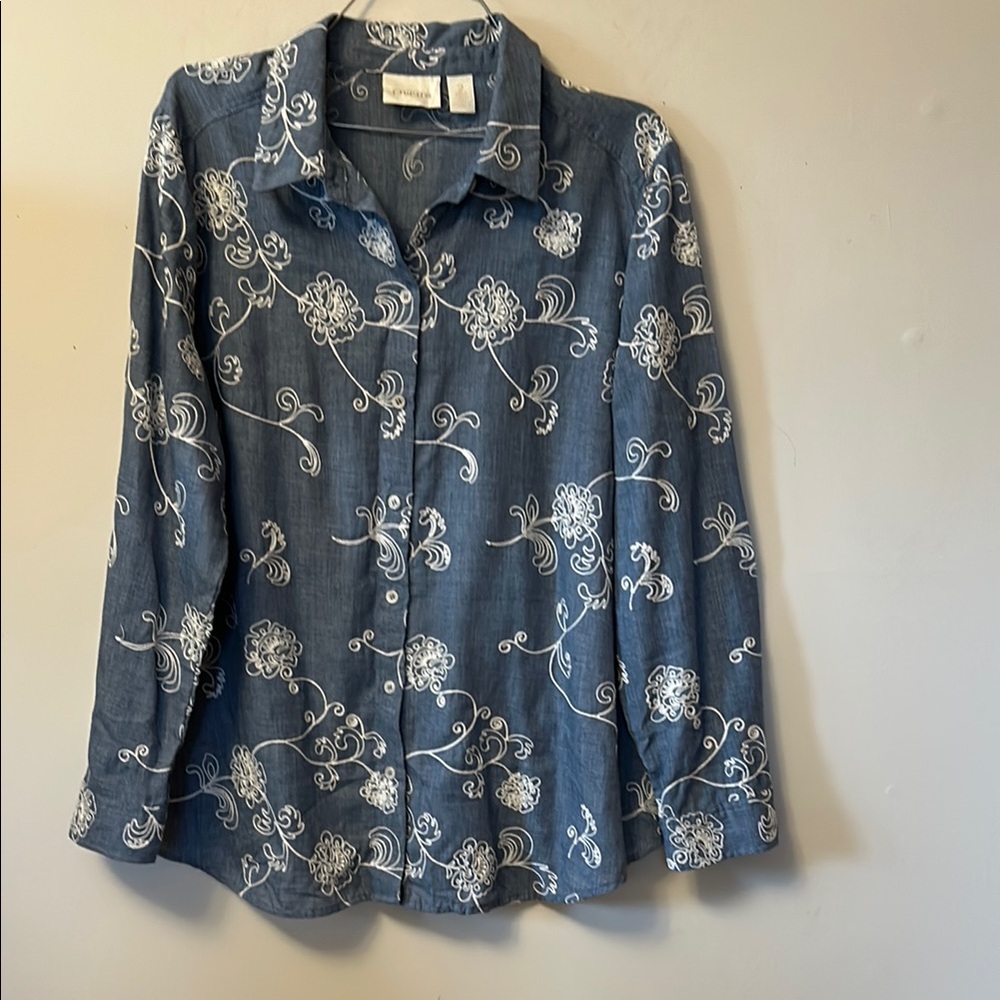 Chico’s size 2 light blue with white floral trim.blouse very good condition